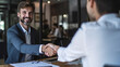 © annebel146 - Business, career and placement concept successful young man smiling and handshaking with european businessman after successful negotiations or interview in office