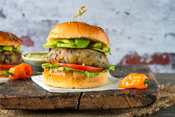 Canvas Print - Plantain and black bean burger in brioche bun