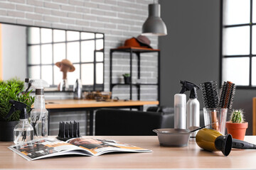 Poster - Different hairdressing tools and magazine on table in beauty salon