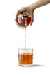 Woman pouring whiskey or cognac from bottle into glass on white background isolated transparent png