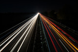 Fototapeta Kwiaty - evening highway with long exposure at dark