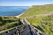 Long wooden staircase leading down to the beach at Mohegan Bluffs, Block Island, Rhode Island, USA