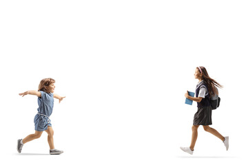 Canvas Print - Little girl running to hug a female student