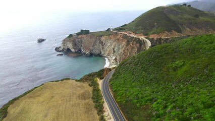 Wall Mural - Aerial video view of coatline with mountains and ocean