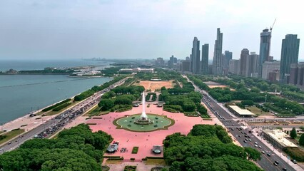 Wall Mural - Buckingham fountain in Chicago at Grant Park aerial view over the city - aerial photography by drone