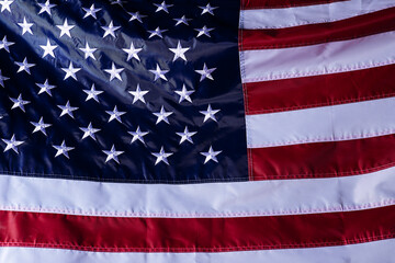 Wall Mural - closeup shot of the waving flag of the United States of America with interesting textures