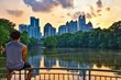 An unrecognizable young man enjoying a Sunset in Piedmont Park, Midtown Atlanta 