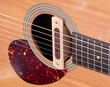 © bjginny - cloise up shot of acoustic guitar sound hole pickup type . made by wood, selective focus