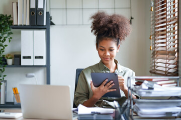 Young afro african american millennial employee trainee working on office desk.