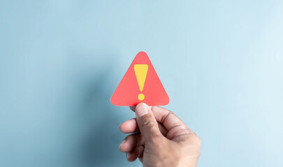 System warning caution sign symbol paper cut out. Notification error and maintenance concept. cyber attack on computer network. Cybersecurity vulnerability, data breach, illegal connection.
