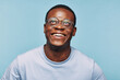 © Flamingo Images - African man looking up and smiling