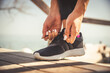 © nickolya - feet running on road closeup on shoe