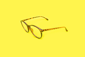 Wall Mural - photo of glasses on yellow paper