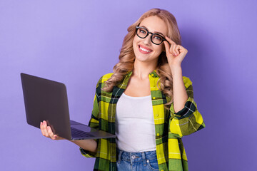 Sticker - Photo of pretty positive girl arm touch eyewear toothy smile hold wireless netbook isolated on violet color background