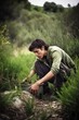 shot of a young man working at an ecological reserve, created with generative ai