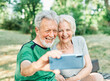 © Lumos sp - woman man outdoor senior couple happy lifestyle retirement together love elderly video call selfie photo mobile smartphone communication phone sport active fitness outfit training healthy