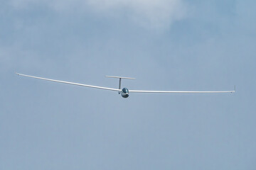 Wall Mural - Glider plane flying in the clouds