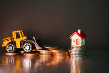 Closeup Stack Coins With Forklift Vehicle Using As Business And Logistics Concept