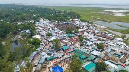 A large group of tents and trees aerial photo