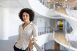© ReeldealHD images - Portrait of an African American businesswoman in modern corporate office atrium