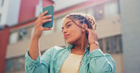 Sticker - Woman, travel and selfie in the city for vlog, profile picture or social media post in the outdoors. Happy female traveler smiling with facial expression for photo, memory or online vlogging in town