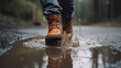 Leinwandbild Motiv close up of a man with hiking boots jumping in a puddle. Generative AI