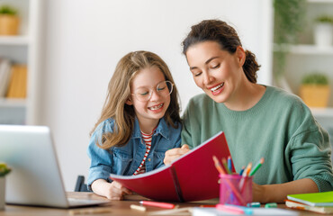 Wall Mural - Girl doing homework or online education.