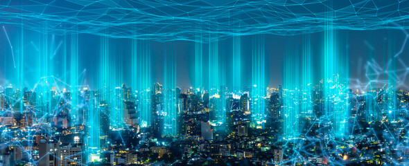 Modern city with wireless network connection and city scape concept.Wireless network and Connection technology concept with city background at night.