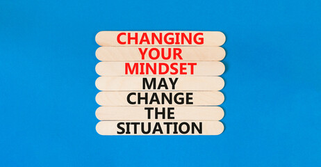 Changing mindset symbol. Concept words Changing your mindset may change the situation on wooden stick on a beautiful blue table blue background. Business motivational Changing mindset concept.