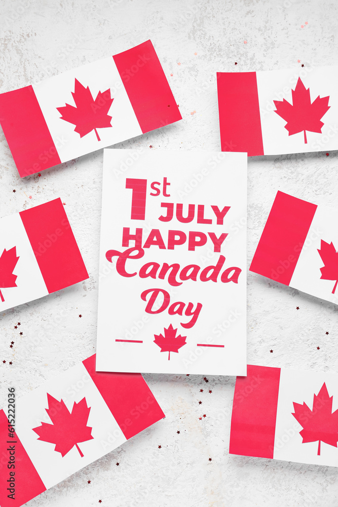 Card with text 1ST JULY HAPPY CANADA DAY and flags on grunge background