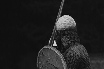 Side portrait of reenactor who act like viking warrior from early middle ages.