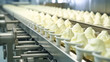 Ice-cream dairy factory - conveyor belt with ice cream cones at modern food processing factory.

