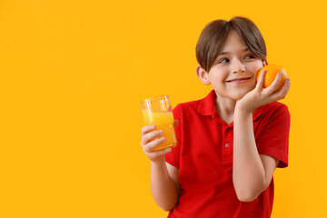 Sticker - Little boy with orange and glass of juice on color background