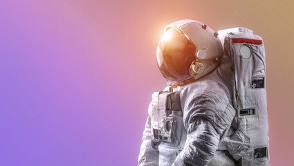 Wall Mural - astronaut isolated on neon gradient background. spaceman alone. sci-fi space wallpaper with bright l