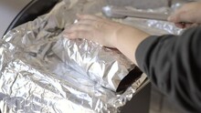 This Video Shows Delicious Smoked Brisket Meat Being Wrapped In Foil.