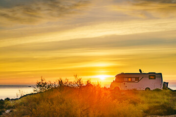 Canvas Print - Caravan on sea at sunrise.