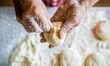 © Yevhen - Homemade cakes dough in the women's hands. Process of making pies, hand. Hands pie dough. Cooks dough for baking, pieces of raw dough. Womans hands rolling doughs for pies. Baking at home