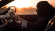 © Adin - Islam female is driver. Arabic Muslim women driving car, sunset light. AI generation