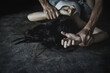 © Tinnakorn - Close up of man hands holding a woman hands for rape and sexual abuse concept, Wound domestic violence rape, sexual assault, stop violence against women, human trafficking.