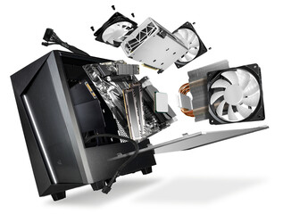 flying parts of a modern computer. hardware components mainboard cpu processor graphic card RAM cables and cooling fan flying out of black silver PC case  isolated abstract technology background