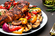 © 5ph - Grilled chicken fillet and vegetables salad. Colorful paprika, zucchini, eggplant, mushrooms, tomatoes, red onion with rosemary, served on plate, brown table background, top view