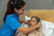 © Jirakul - Female nurse giving oxygen to a patient in hospital