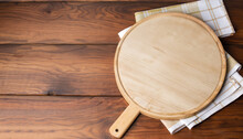 Napkin And Board For Pizza On Wooden Desk Mockup. Selective Focus.