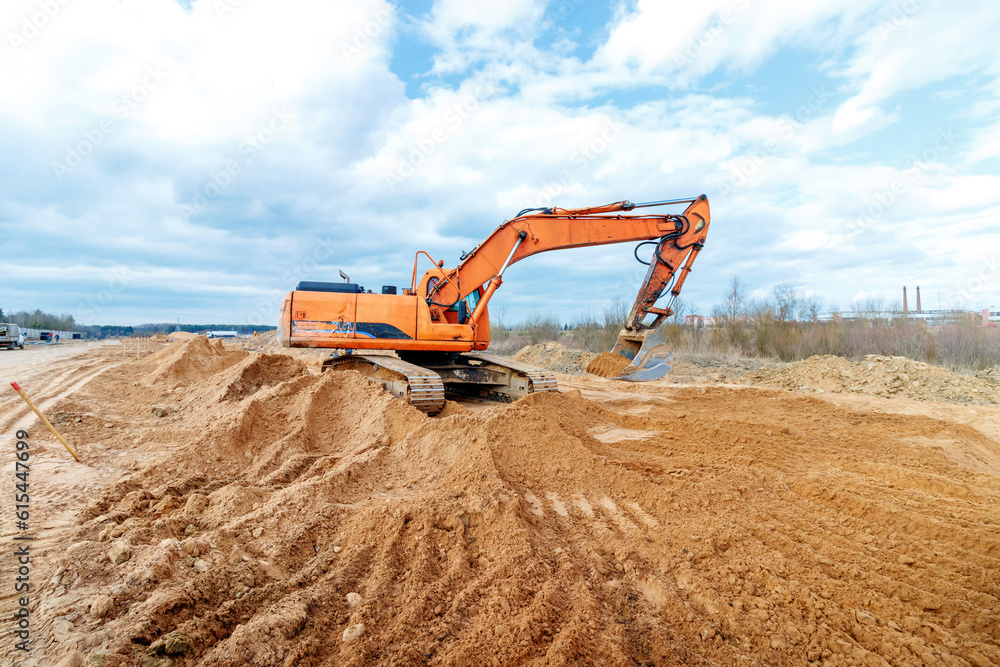 Excavator dig the trenches at a construction site. Trench for laying ...