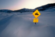 © Designpics - 'Snowmobile Crossing' sign in a snowdrift; Crested Butte, Colorado, United States of America
