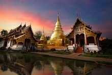Chapel And Golden Pagoda At Wat Phra Singh Woramahawihan  At Twilight Or Night.  Chiang Mai Province Of Thailand