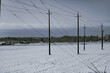 © Designpics - Snow covers a field in the countryside with overhead power lines; Langley, British Columbia, Canada