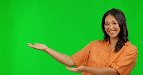 Sticker - Happy asian woman, hands and presentation on green screen for advertising against a studio background. Portrait of female person showing palm for advertisement, news or marketing with mockup space