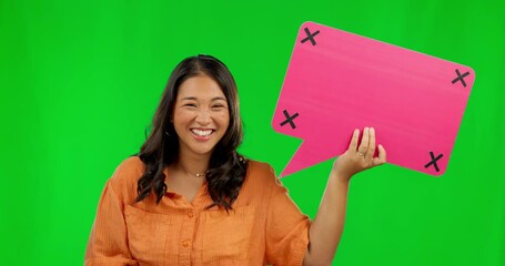 Wall Mural - Happy asian woman, speech bubble and pointing on green screen for comment against a studio background. Portrait of female person with smile and icon for feedback, social media and tracking markers