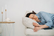 © ADDICTIVE STOCK - Mature woman sleeping on sofa